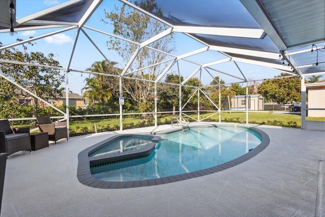 view of pool with a storage unit, a lanai, and a patio