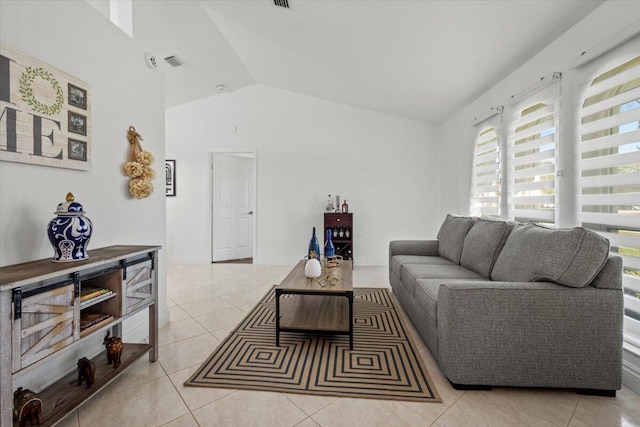 tiled living room featuring lofted ceiling