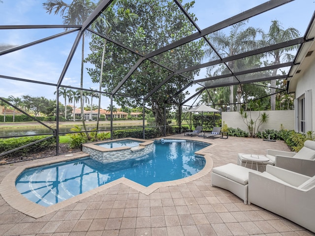 view of pool featuring glass enclosure, an in ground hot tub, a patio, and an outdoor hangout area