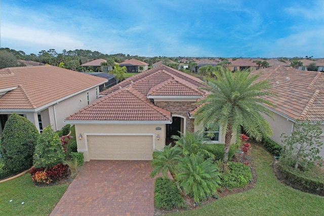 mediterranean / spanish-style home featuring a garage