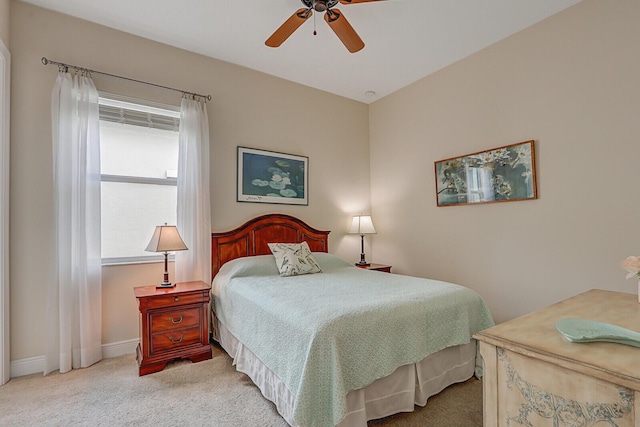 bedroom featuring light carpet and ceiling fan