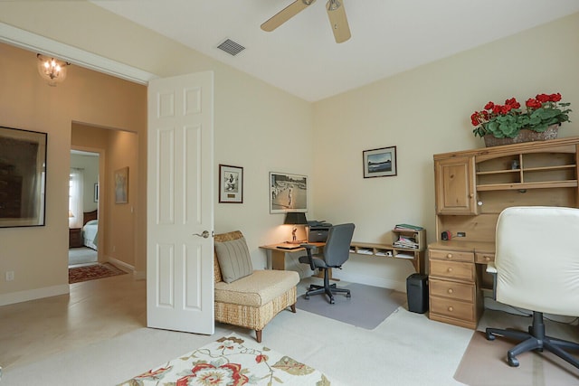 office area featuring light colored carpet and ceiling fan with notable chandelier