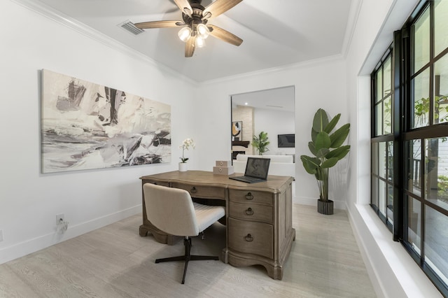 office space featuring ceiling fan, plenty of natural light, and ornamental molding