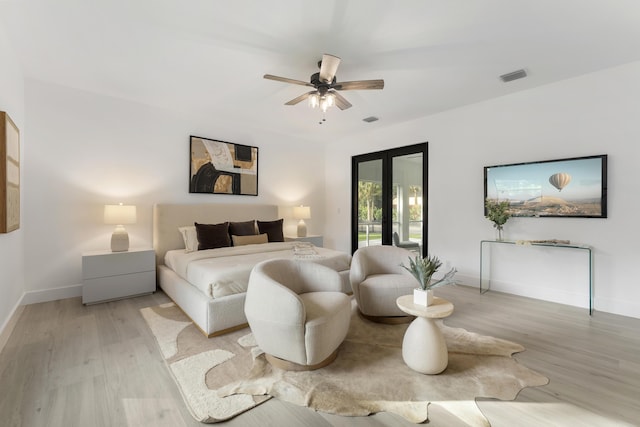 bedroom featuring ceiling fan, access to exterior, and light hardwood / wood-style floors