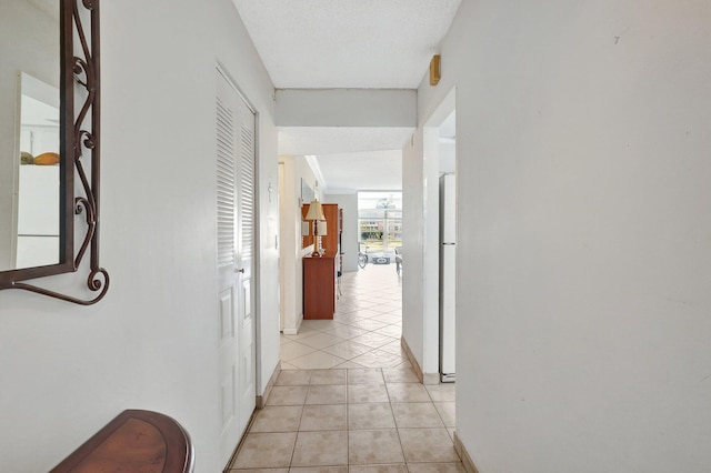 hallway with light tile patterned flooring