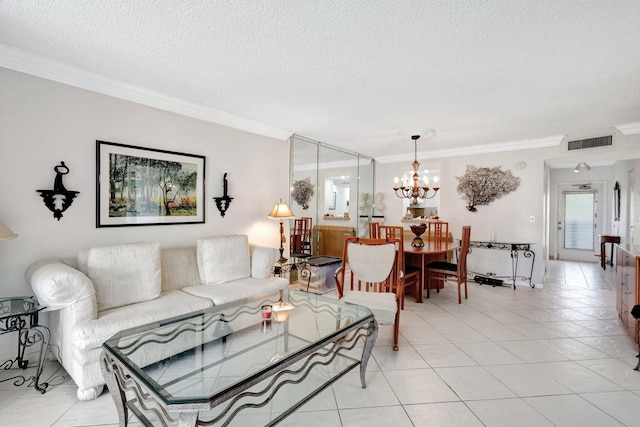 27 Abbey Ln Unit 205, Delray Beach, FL 33446 - living room featuring crown molding, light tile patterned flooring, an inviting chandelier, and a textured ceiling