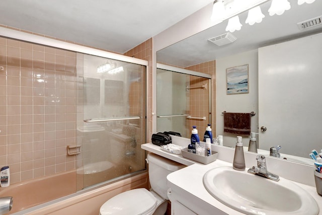 27 Abbey Ln Unit 205, Delray Beach, FL 33446 - full bathroom featuring vanity, combined bath / shower with glass door, and toilet