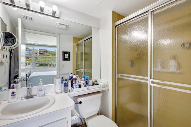 27 Abbey Ln Unit 205, Delray Beach, FL 33446 - bathroom with walk in shower, vanity, and toilet