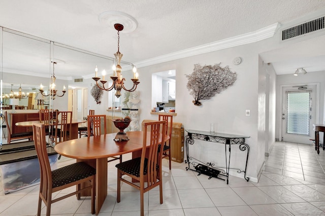 27 Abbey Ln Unit 205, Delray Beach, FL 33446 - dining area with ornamental molding, a chandelier, a textured ceiling, and light tile patterned floors
