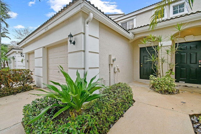 doorway to property featuring a garage