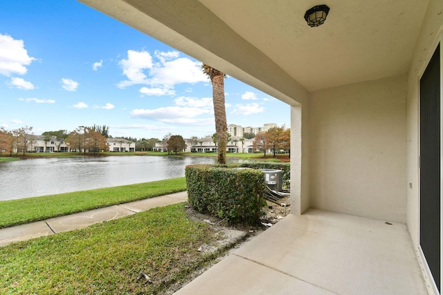 view of patio / terrace with a water view