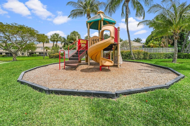 view of jungle gym with a lawn