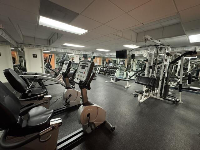 exercise room featuring a drop ceiling