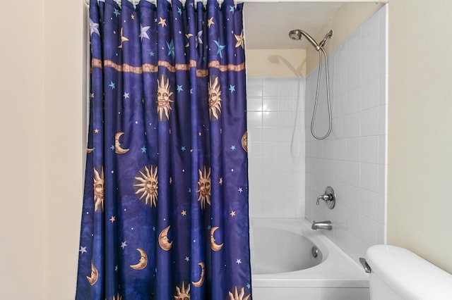 bathroom featuring toilet and shower / tub combo