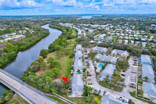 bird's eye view with a residential view and a water view