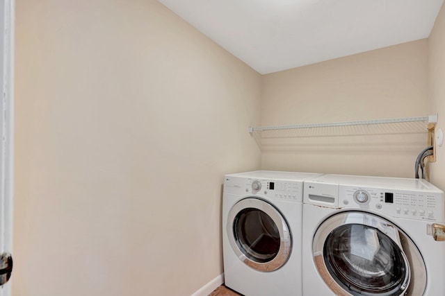 washroom with washer and clothes dryer