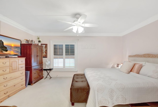 bedroom featuring ceiling fan, light carpet, and crown molding