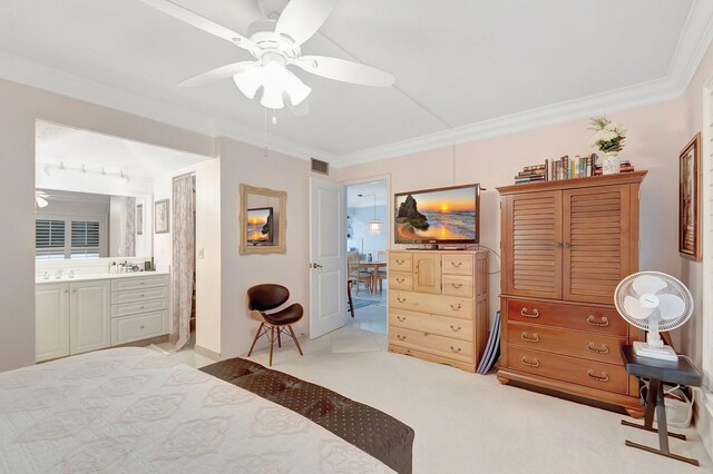 bedroom featuring crown molding, carpet floors, connected bathroom, and ceiling fan