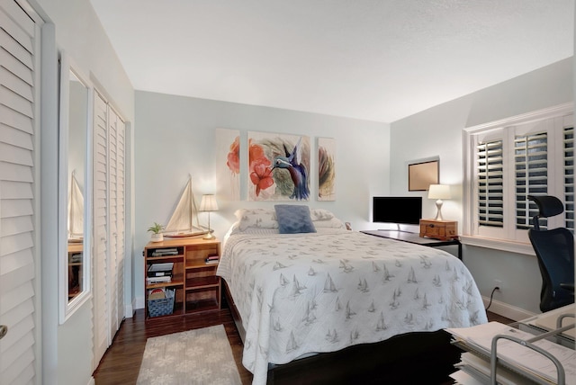 bedroom featuring a closet and dark hardwood / wood-style floors