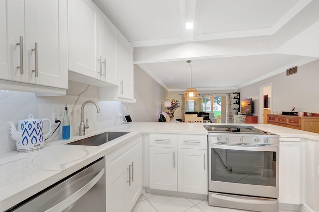 kitchen with sink, stainless steel appliances, white cabinetry, and light tile patterned floors