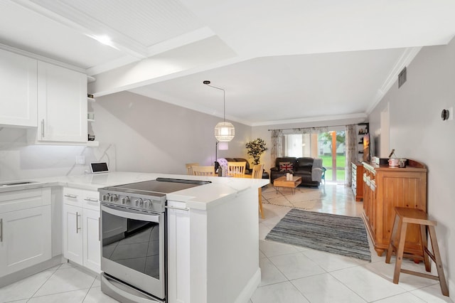 kitchen with kitchen peninsula, white cabinets, stainless steel range with electric stovetop, and light tile patterned floors