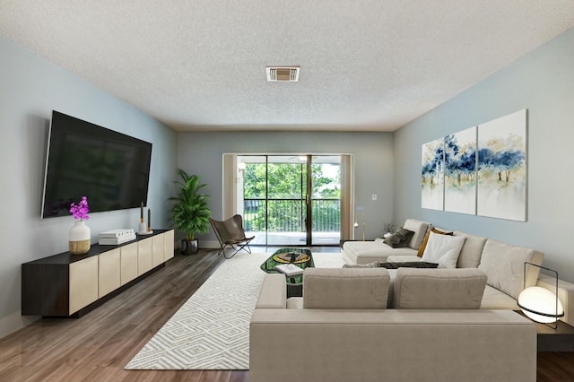 living room with dark wood-type flooring and a textured ceiling