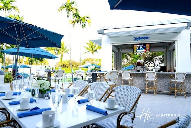 view of patio / terrace featuring an outdoor bar