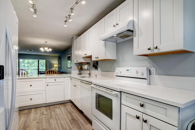 kitchen with kitchen peninsula, sink, white cabinetry, white appliances, and light hardwood / wood-style floors