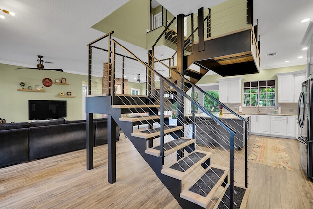 interior space with hardwood / wood-style flooring and ornamental molding