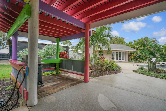 view of patio / terrace featuring a pergola and french doors