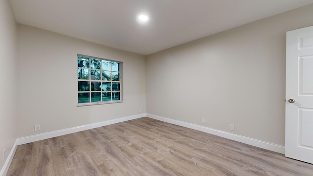 spare room with light hardwood / wood-style floors