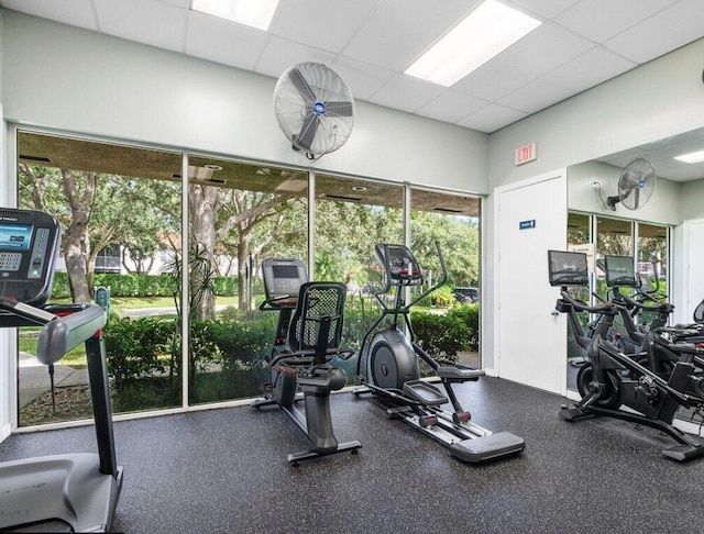 workout area featuring a paneled ceiling