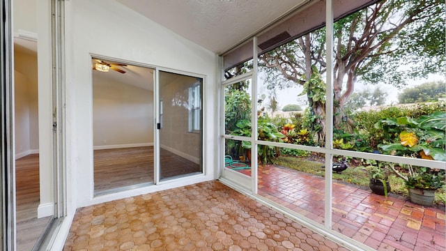 unfurnished sunroom with lofted ceiling