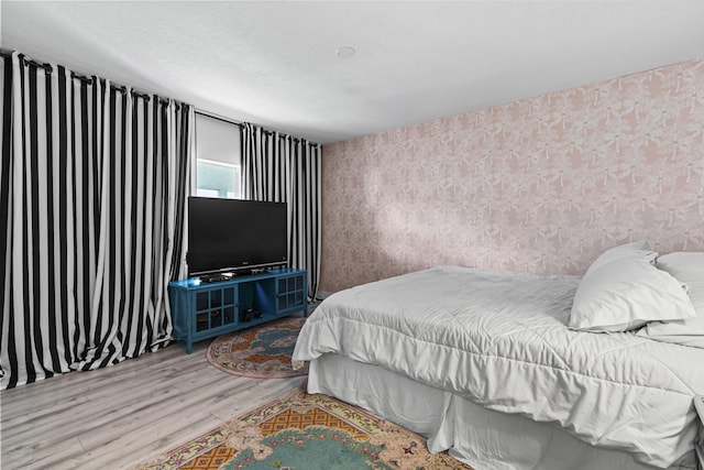 bedroom with wood-type flooring