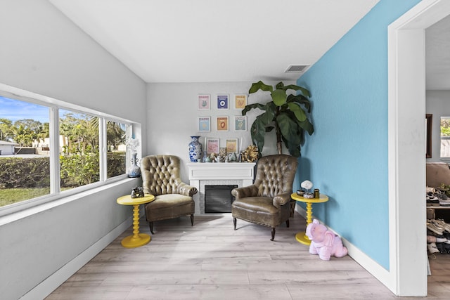 living area with light hardwood / wood-style floors