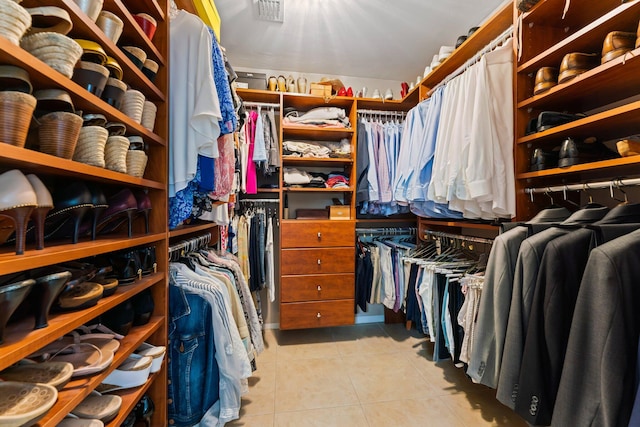 spacious closet featuring light tile patterned floors