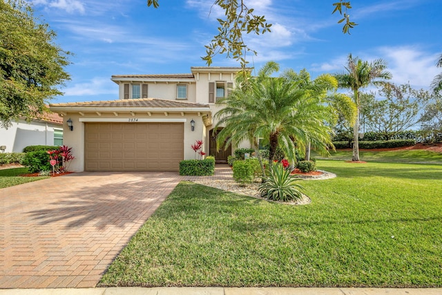 mediterranean / spanish house featuring a front yard