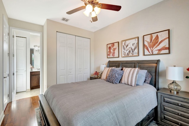 bedroom featuring ceiling fan, a closet, and light hardwood / wood-style flooring