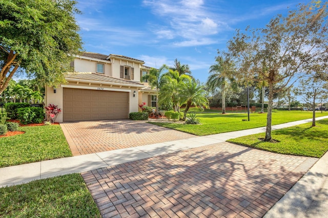 view of front of home featuring a garage and a front yard