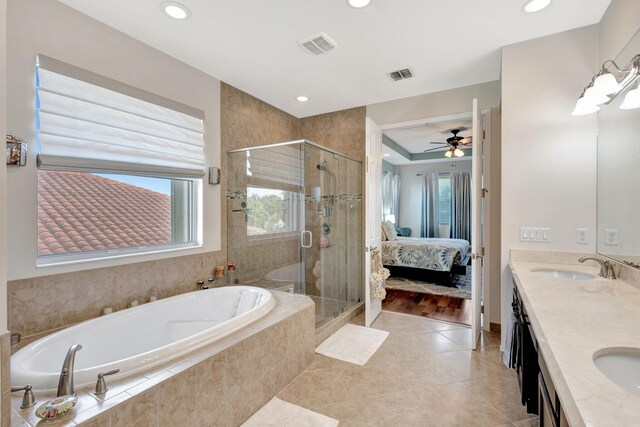 bathroom with vanity, a wealth of natural light, tile patterned floors, and shower with separate bathtub