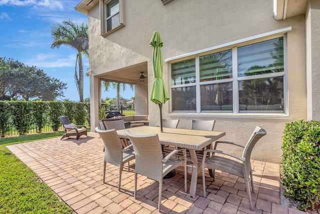 view of patio / terrace featuring ceiling fan