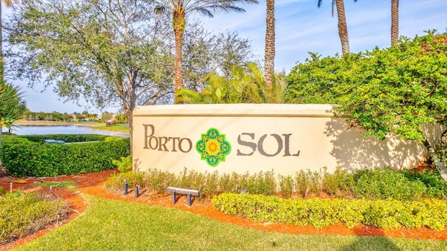 community / neighborhood sign featuring a water view