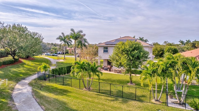 view of property's community featuring a yard