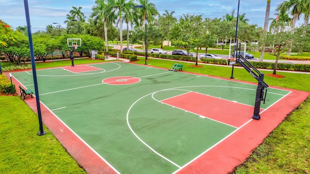 view of basketball court featuring a lawn