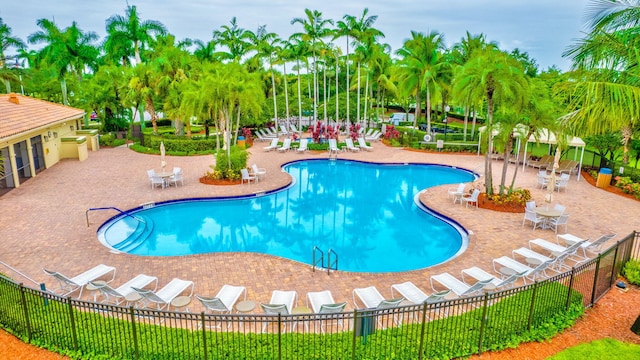 view of swimming pool with a patio