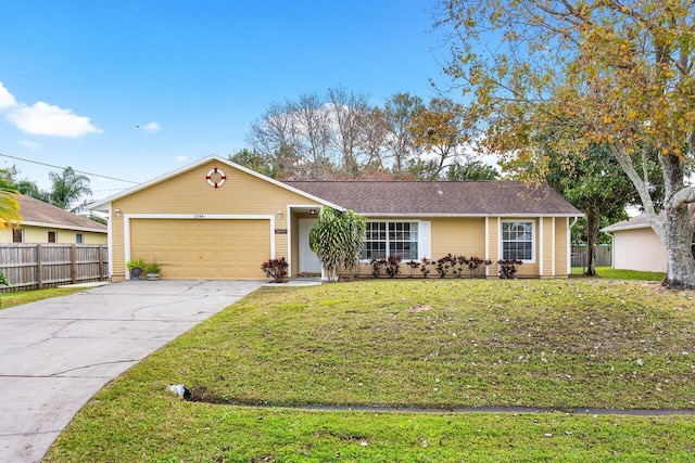 ranch-style house with a garage and a front lawn