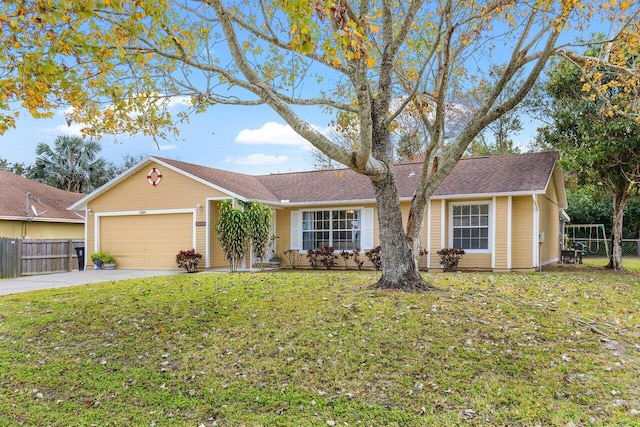 single story home featuring a front yard and a garage