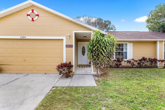 single story home featuring a garage and a front lawn