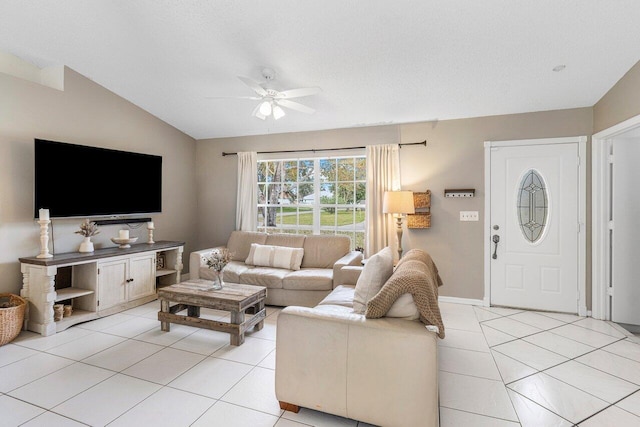 living room featuring light tile patterned flooring, ceiling fan, and lofted ceiling