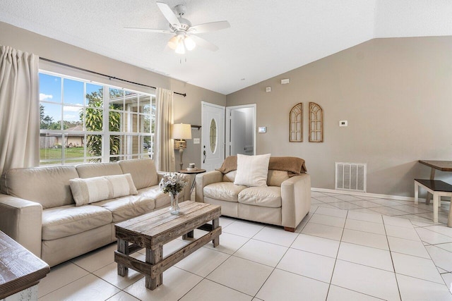 tiled living room featuring vaulted ceiling and ceiling fan